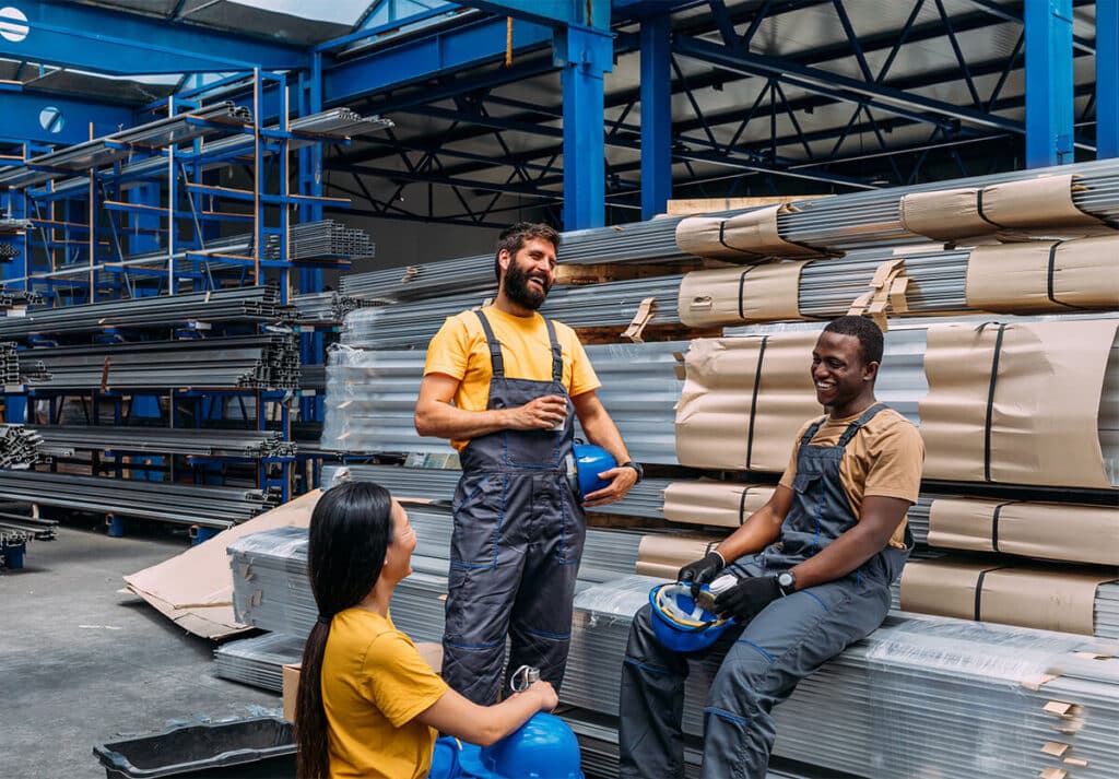 Workers in a factory wearing sustainable uniforms