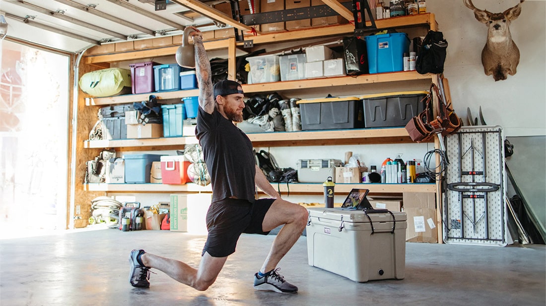 Man training in garage gym